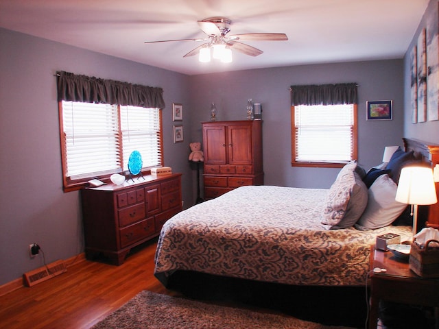 571 Dawn Cir, Grayslake, IL 60030 - bedroom with visible vents, wood finished floors, baseboards, and ceiling fan