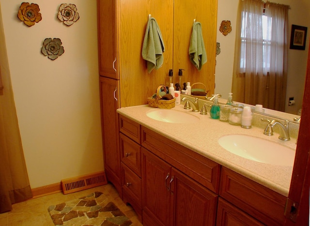 571 Dawn Cir, Grayslake, IL 60030 - bathroom with tile patterned floors, visible vents, a sink, and double vanity