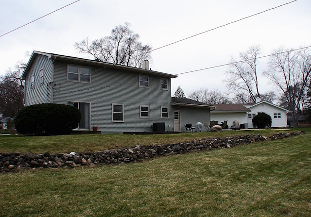 571 Dawn Cir, Grayslake, IL 60030 - exterior space featuring a chimney, cooling unit, and a lawn