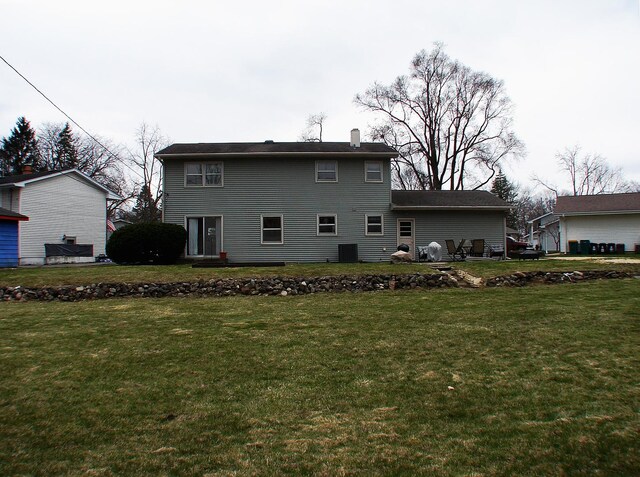 571 Dawn Cir, Grayslake, IL 60030 - back of property featuring a chimney and a yard