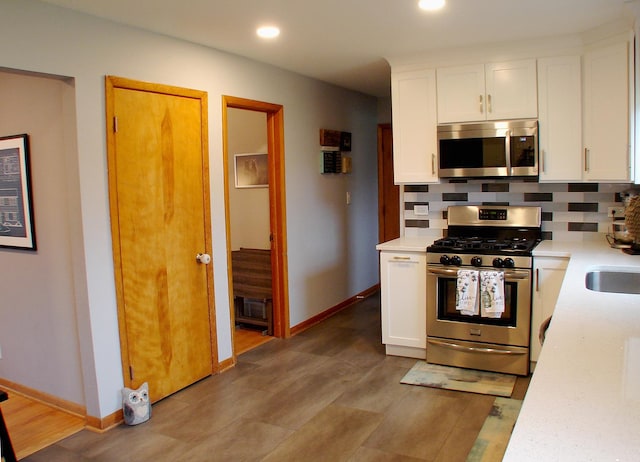 571 Dawn Cir, Grayslake, IL 60030 - kitchen with white cabinetry, light countertops, and stainless steel appliances