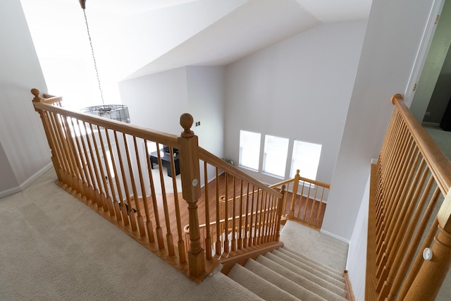 131 Glenbrook Cir, Gilberts, IL 60136 - stairs featuring carpet, vaulted ceiling, and baseboards