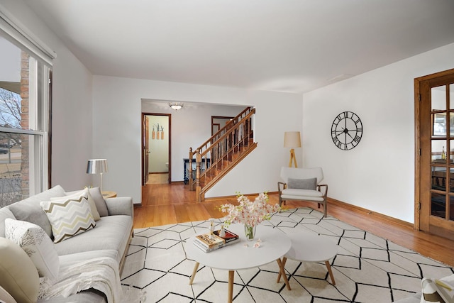 2800 Abbington Dr, New Lenox, IL 60451 - living area featuring stairs, healthy amount of natural light, light wood-style floors, and baseboards