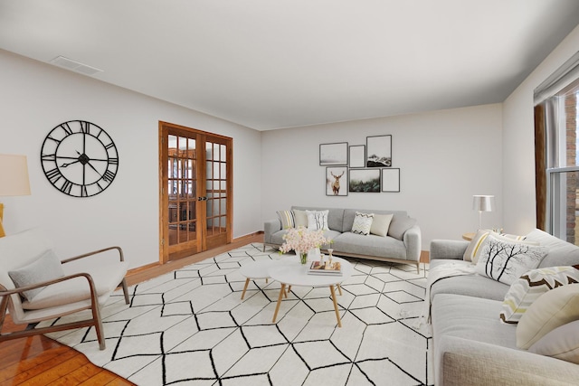2800 Abbington Dr, New Lenox, IL 60451 - living room featuring light wood-style flooring, french doors, and baseboards
