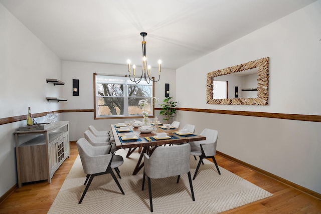 2800 Abbington Dr, New Lenox, IL 60451 - dining area with a chandelier, light wood-style flooring, and baseboards