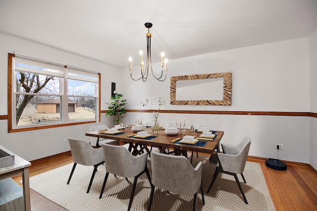 2800 Abbington Dr, New Lenox, IL 60451 - dining room with a chandelier, wood finished floors, and baseboards
