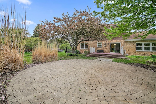 2800 Abbington Dr, New Lenox, IL 60451 - view of patio featuring curved driveway and a deck