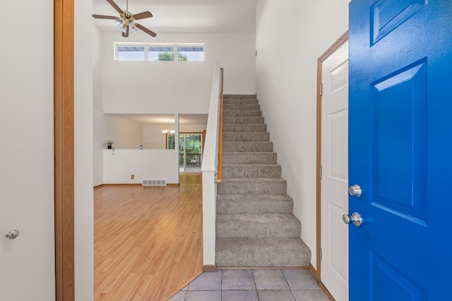 726 Hawthorne Ln, Genoa, IL 60135 - entryway with stairway, plenty of natural light, ceiling fan, and a chandelier