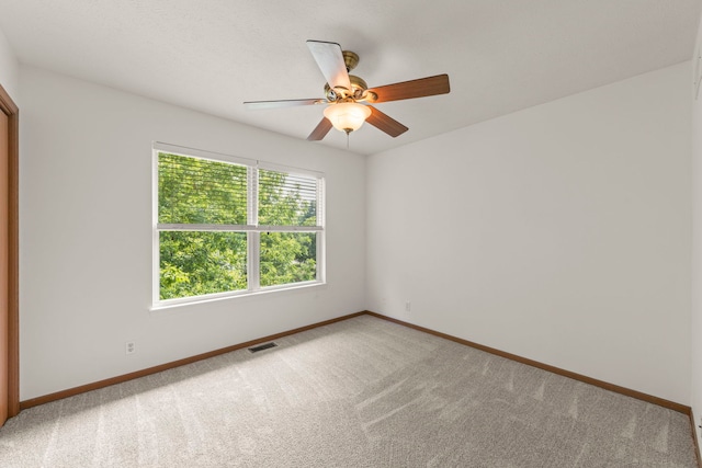726 Hawthorne Ln, Genoa, IL 60135 - empty room featuring light colored carpet and ceiling fan
