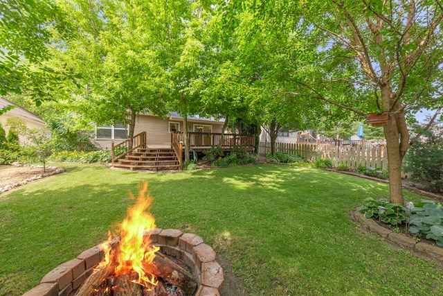 726 Hawthorne Ln, Genoa, IL 60135 - view of yard featuring a deck, an outdoor fire pit, and stairway