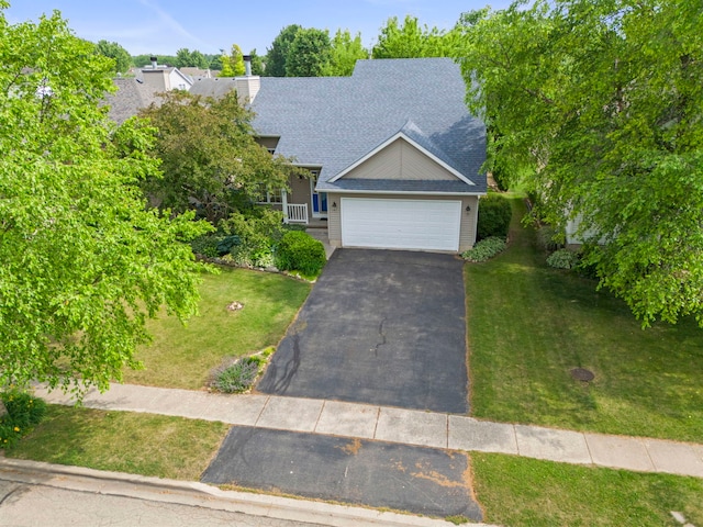 726 Hawthorne Ln, Genoa, IL 60135 - view of front of property with a front lawn, driveway, a garage, and a shingled roof