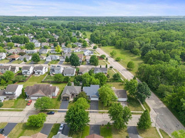 726 Hawthorne Ln, Genoa, IL 60135 - aerial perspective of suburban area featuring a heavily wooded area