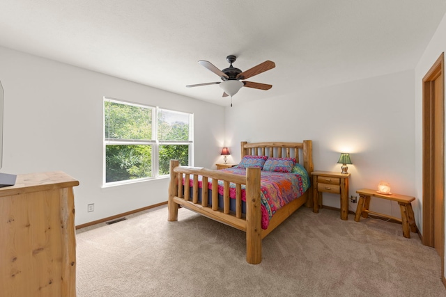 726 Hawthorne Ln, Genoa, IL 60135 - carpeted bedroom with baseboards and a ceiling fan