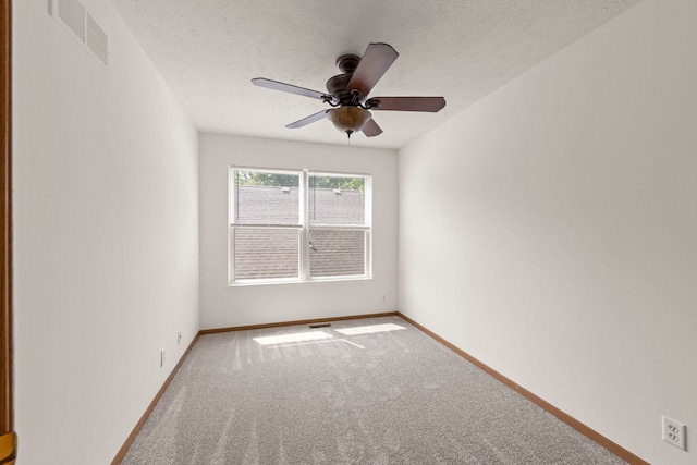 726 Hawthorne Ln, Genoa, IL 60135 - carpeted empty room with a textured ceiling and a ceiling fan