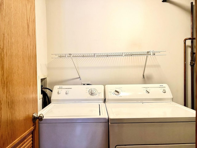 washroom featuring washer and dryer
