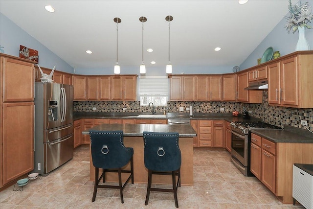 24725 W Hawthorne Dr, Round Lake, IL 60073 - kitchen featuring stainless steel appliances, under cabinet range hood, backsplash, vaulted ceiling, and a sink