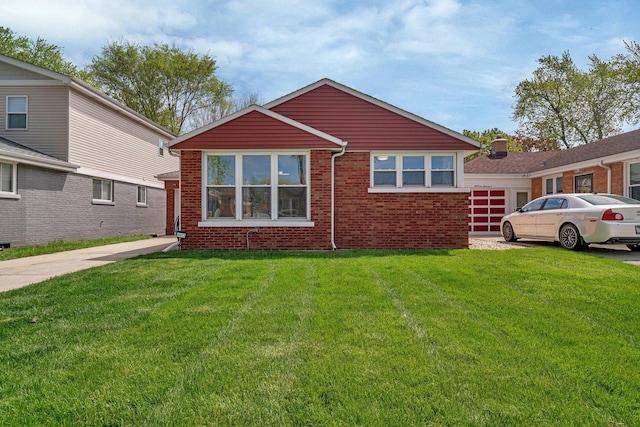 view of front facade with brick siding, a front lawn, and a garage