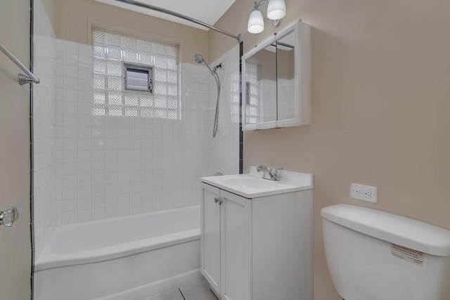 bathroom featuring bathing tub / shower combination, vanity, toilet, and tile patterned flooring