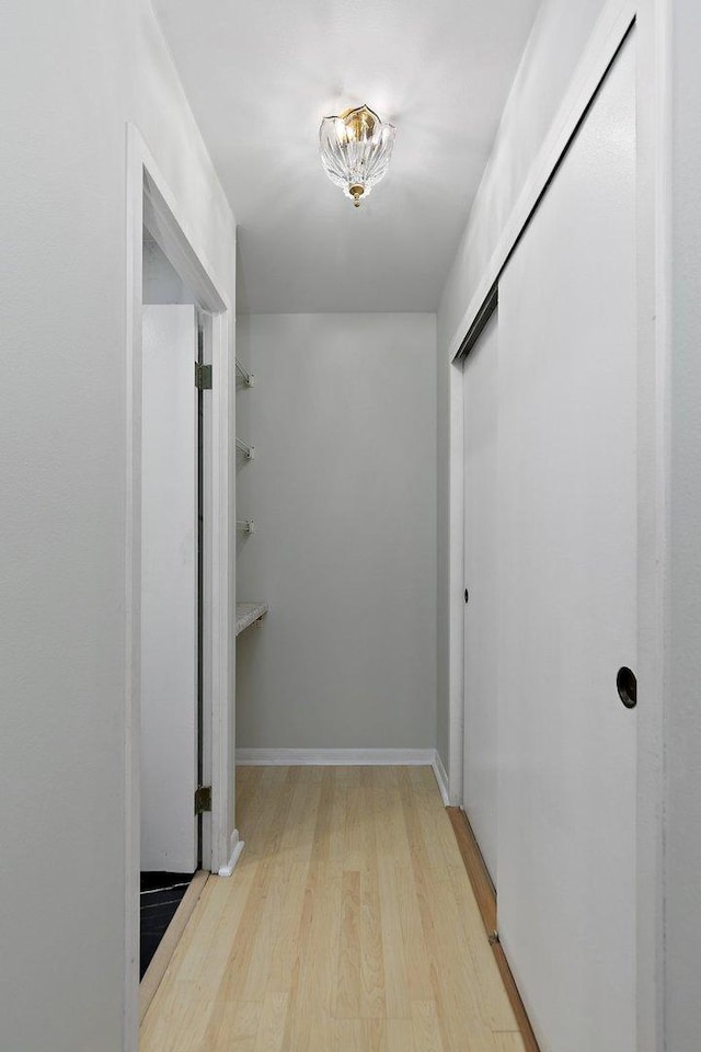 hall with wood finished floors