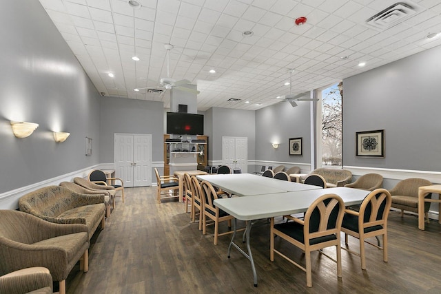 dining room featuring ceiling fan, wood finished floors, wainscoting, and recessed lighting