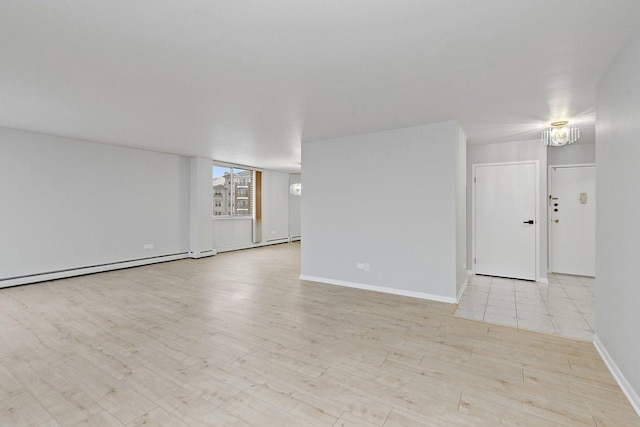 empty room with wood finished floors and baseboards