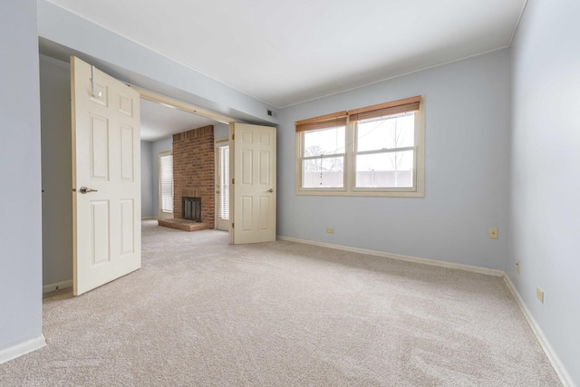 26 Prairie Dr, Westmont, IL 60559 - unfurnished bedroom with baseboards, a fireplace, and carpet floors