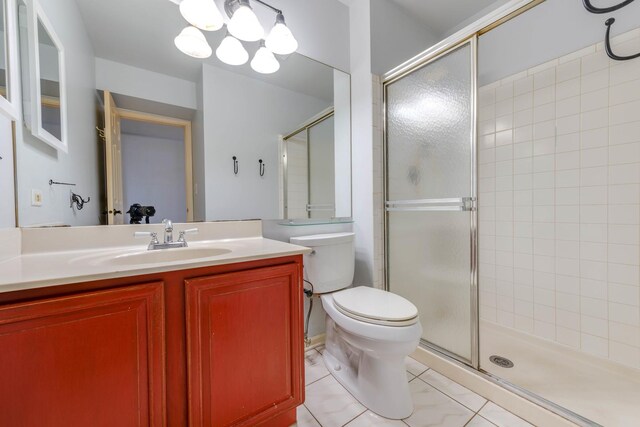 26 Prairie Dr, Westmont, IL 60559 - bathroom featuring tile patterned floors, toilet, a stall shower, and vanity