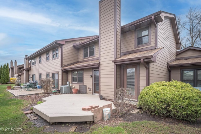 26 Prairie Dr, Westmont, IL 60559 - rear view of property featuring a chimney, cooling unit, a wooden deck, and a patio