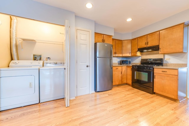 26 Prairie Dr, Westmont, IL 60559 - kitchen with light countertops, stainless steel appliances, light wood-type flooring, under cabinet range hood, and independent washer and dryer