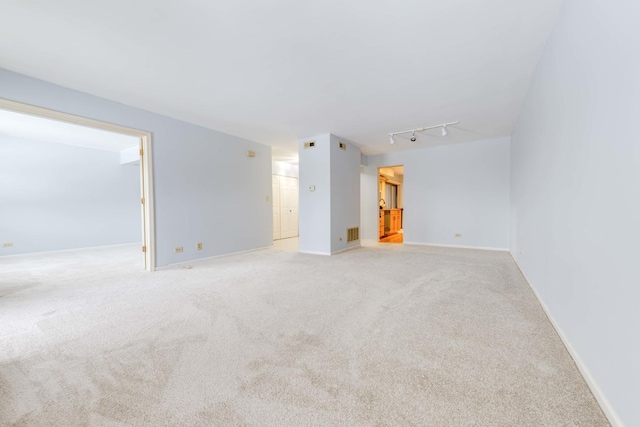 26 Prairie Dr, Westmont, IL 60559 - spare room featuring baseboards, light carpet, visible vents, and track lighting