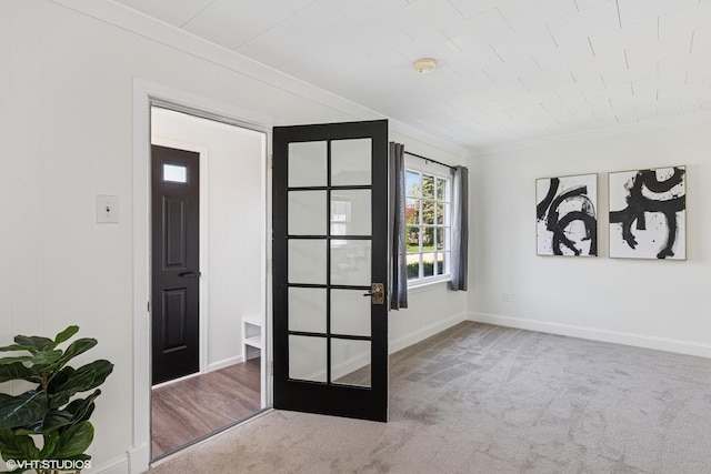 519 Catalpa Dr, Round Lake, IL 60073 - doorway with carpet flooring, ornamental molding, and baseboards
