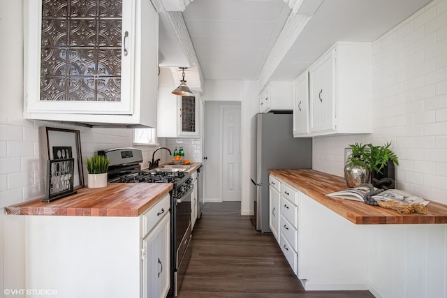 519 Catalpa Dr, Round Lake, IL 60073 - kitchen featuring butcher block counters, appliances with stainless steel finishes, white cabinetry, and backsplash