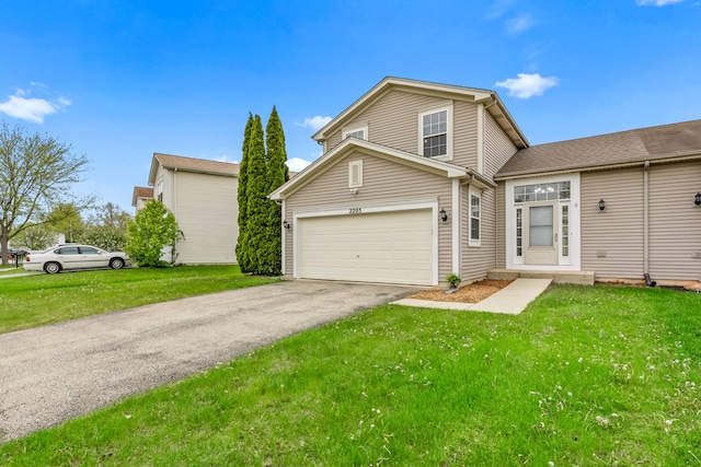 view of front of house with driveway, a front yard, and a garage