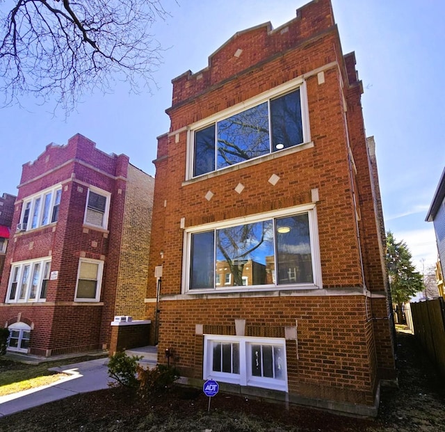 5321 W Crystal St, Chicago, IL 60651 - rear view of property featuring fence and brick siding
