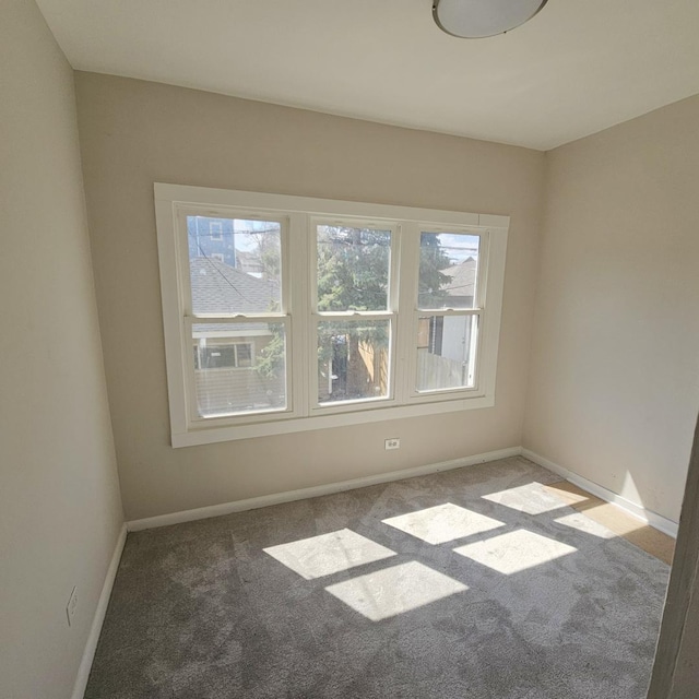 5321 W Crystal St, Chicago, IL 60651 - empty room featuring baseboards and carpet floors