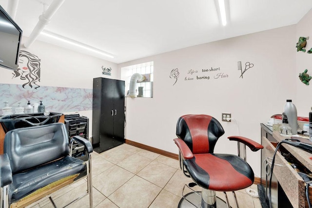 office featuring baseboards and light tile patterned flooring