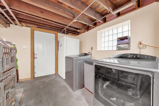 washroom with washer and clothes dryer and laundry area