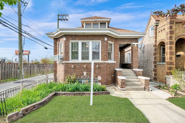 bungalow-style home featuring brick siding, a front lawn, and fence