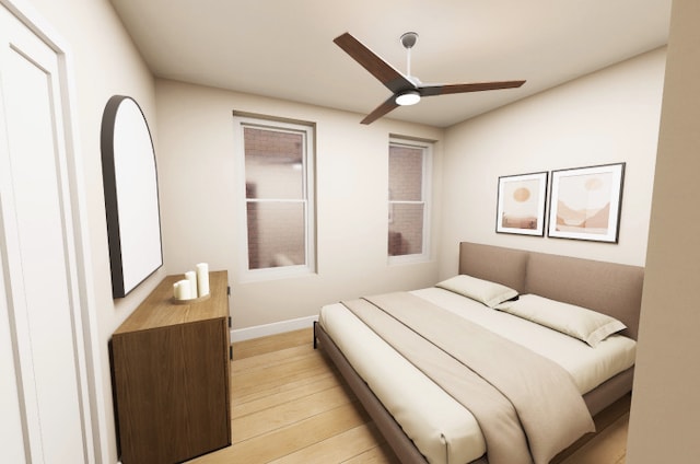 3408 S Carpenter St, Chicago, IL 60608 - bedroom with light wood finished floors, baseboards, and ceiling fan