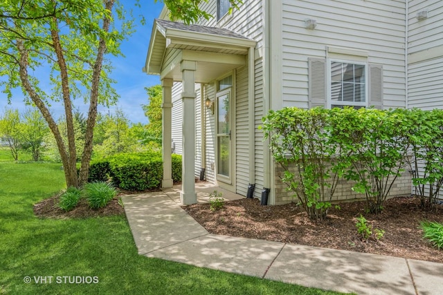 entrance to property with a yard