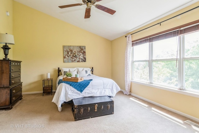 bedroom with baseboards, carpet flooring, lofted ceiling, and a ceiling fan