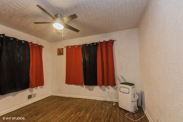 15427 Winchester Ave, Harvey, IL 60426 - empty room featuring baseboards, dark wood-type flooring, a ceiling fan, and visible vents