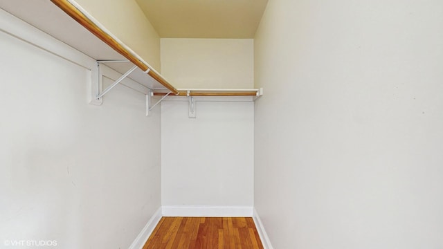 spacious closet with wood finished floors