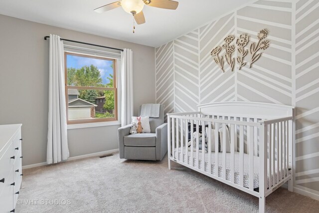 690 Queenswood Ln, Wheaton, IL 60189 - carpeted bedroom featuring baseboards, a nursery area, wallpapered walls, and a ceiling fan