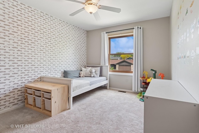 690 Queenswood Ln, Wheaton, IL 60189 - carpeted bedroom featuring wallpapered walls, baseboards, ceiling fan, and an accent wall