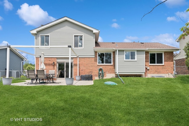 690 Queenswood Ln, Wheaton, IL 60189 - back of house featuring brick siding, a yard, and a patio area