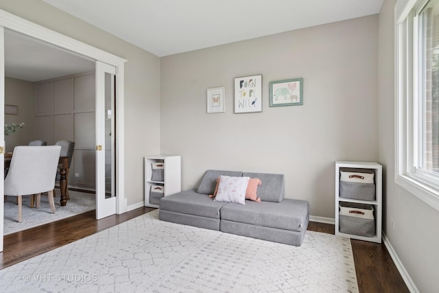 690 Queenswood Ln, Wheaton, IL 60189 - living room with dark wood-style floors and baseboards