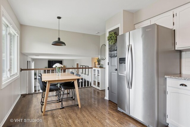 690 Queenswood Ln, Wheaton, IL 60189 - kitchen featuring stainless steel fridge, dark wood-type flooring, white cabinets, pendant lighting, and light stone counters