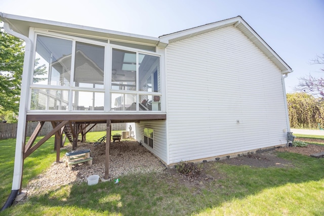 1012 Belden Way, Joliet, IL 60435 - view of home's exterior featuring stairway, a sunroom, and a lawn