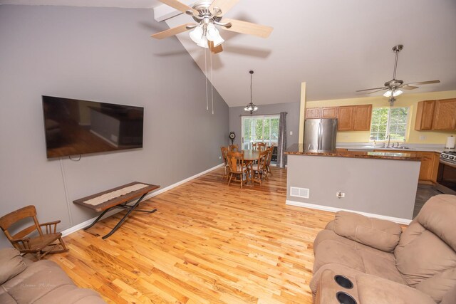1012 Belden Way, Joliet, IL 60435 - living room featuring ceiling fan, light wood-style flooring, healthy amount of natural light, and high vaulted ceiling